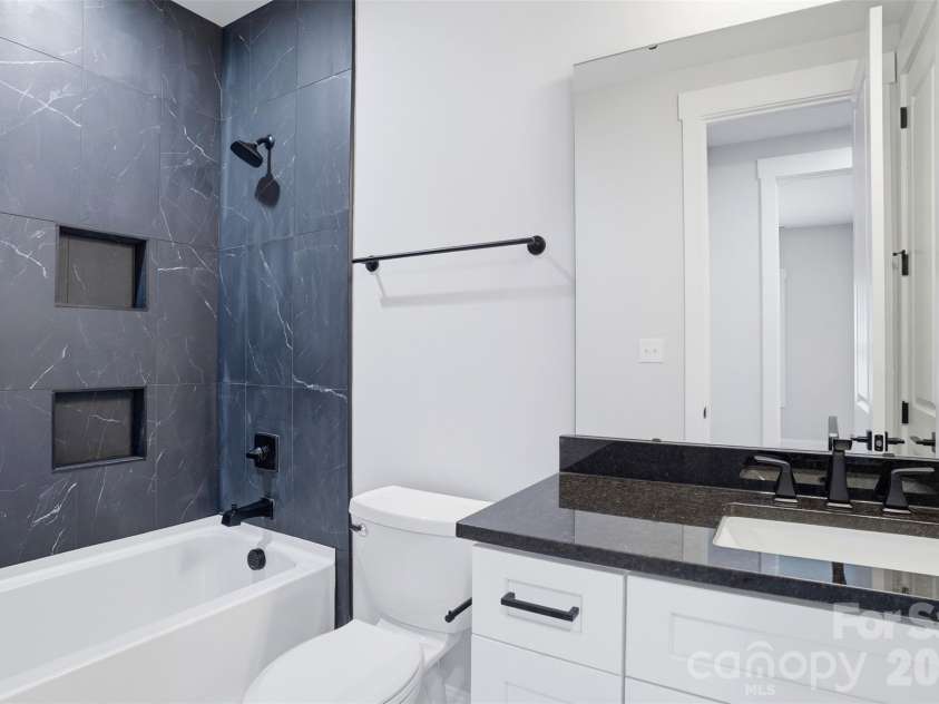 302 Lima Avenue, Charlotte, NC 28208.  MLS# CAR4363412, YatesRealty ID 19070. Full guest bathroom with matching pulls throughout