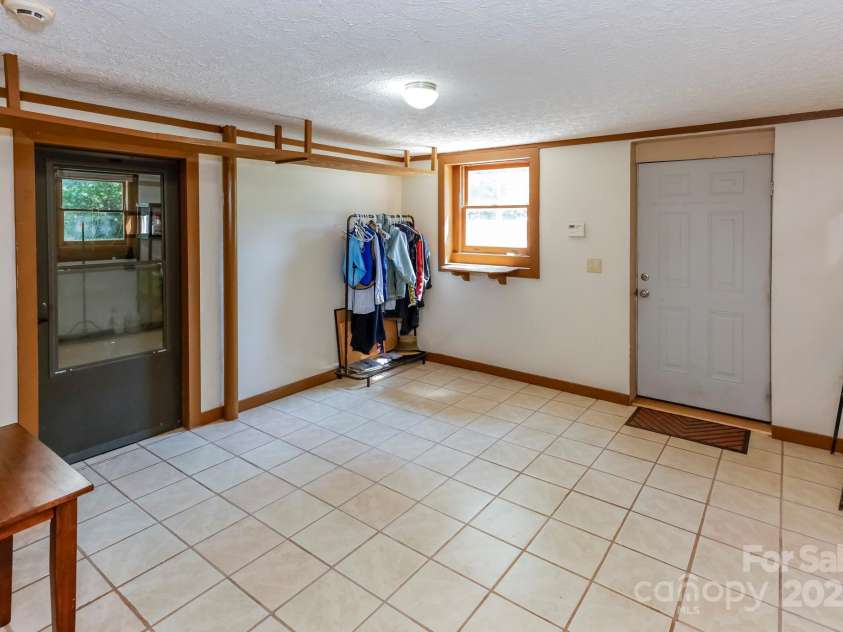 189 Greenhill Ridge Drive, Rutherfordton, NC 28139.  MLS# CAR4270238, YatesRealty ID 19071. Entry/mud in basement