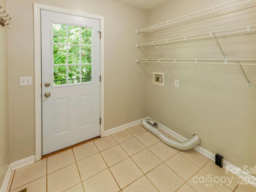 189 Greenhill Ridge Drive, Rutherfordton, NC 28139.  MLS# CAR4270238, YatesRealty ID 19071. Laundry/mud room. Side door leads to side of deck. Opposite of this is the 1/2 bath for guests