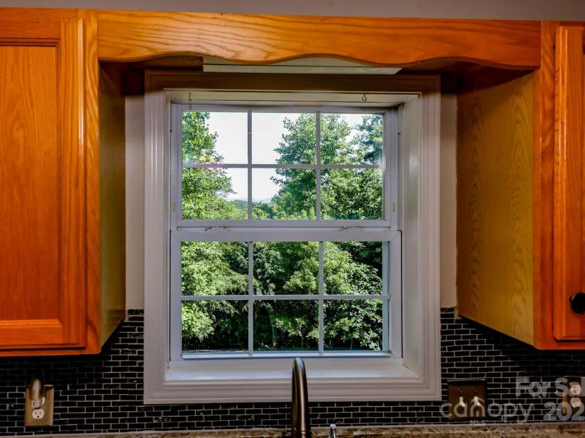 189 Greenhill Ridge Drive, Rutherfordton, NC 28139.  MLS# CAR4270238, YatesRealty ID 19071. Mountains peeking through the kitchen window