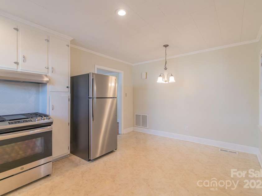208 Thompson Street, Monroe, NC 28112.  MLS# CAR4268630, YatesRealty ID 19074. Kitchen with Dining Area