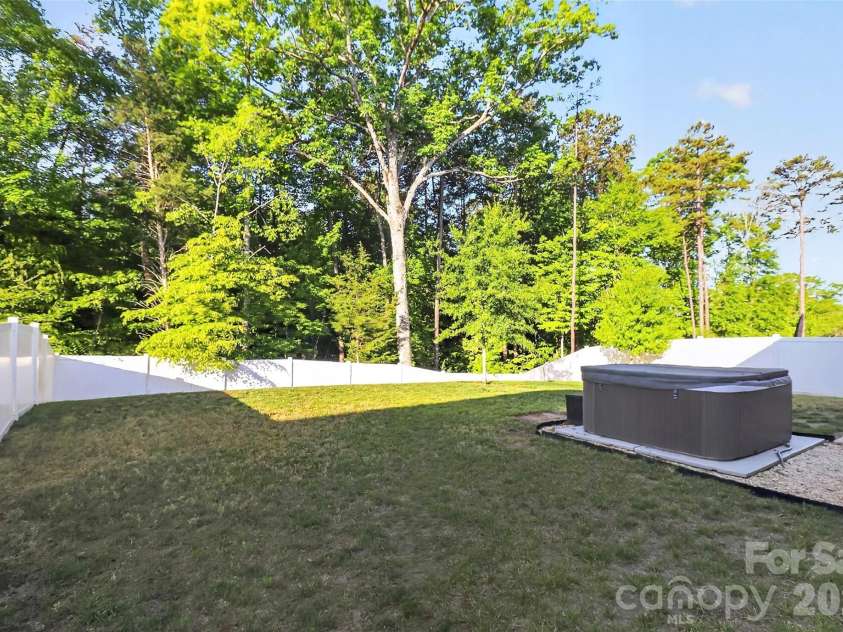 1212 Englewood Drive, Lake Wylie, SC 29710.  MLS# CAR4371368, YatesRealty ID 19075. Private, tree-lined backyard. Hot tub remains!