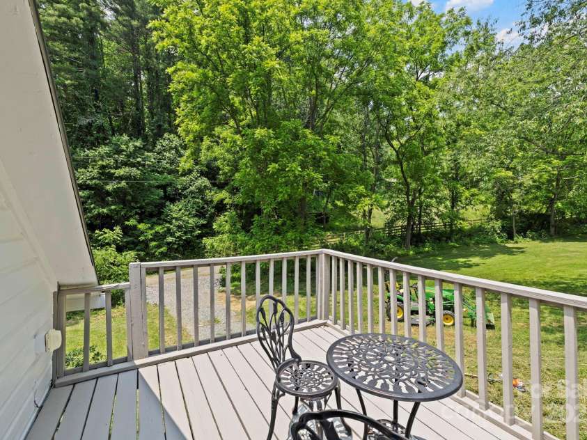 51 HOMEFIRE COVE Cove, Leicester, NC 28748.  MLS# CAR4269158, YatesRealty ID 19075. Deck off loft 