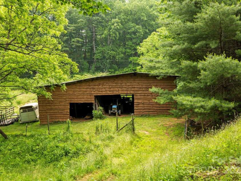 51 HOMEFIRE COVE Cove, Leicester, NC 28748.  MLS# CAR4269158, YatesRealty ID 19075. Equipment barn with Carolina siding