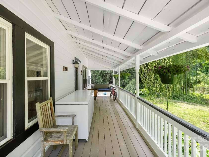 51 HOMEFIRE COVE Cove, Leicester, NC 28748.  MLS# CAR4269158, YatesRealty ID 19075. Rocking chair porch