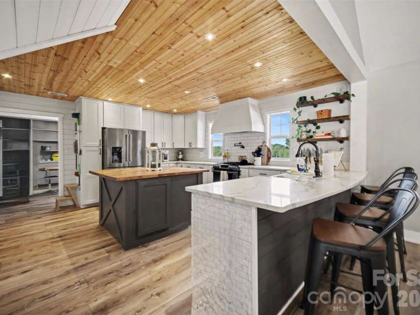 5226 Old Plank Road, Iron Station, NC 28080.  MLS# CAR4365700, YatesRealty ID 19087. Additional island w/seating