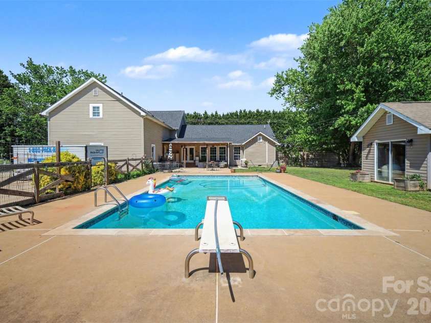 5226 Old Plank Road, Iron Station, NC 28080.  MLS# CAR4365700, YatesRealty ID 19087. Diving board makes for extra fun