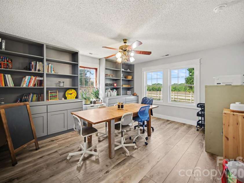 5226 Old Plank Road, Iron Station, NC 28080.  MLS# CAR4365700, YatesRealty ID 19087. This library/homeschool room is just off the kitchen