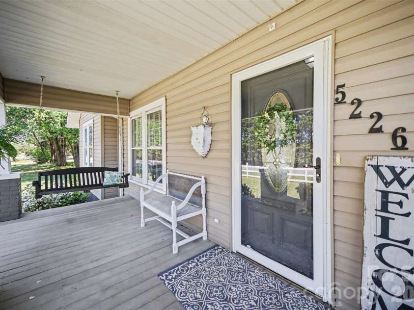 5226 Old Plank Road, Iron Station, NC 28080.  MLS# CAR4365700, YatesRealty ID 19087. Welcoming front porch