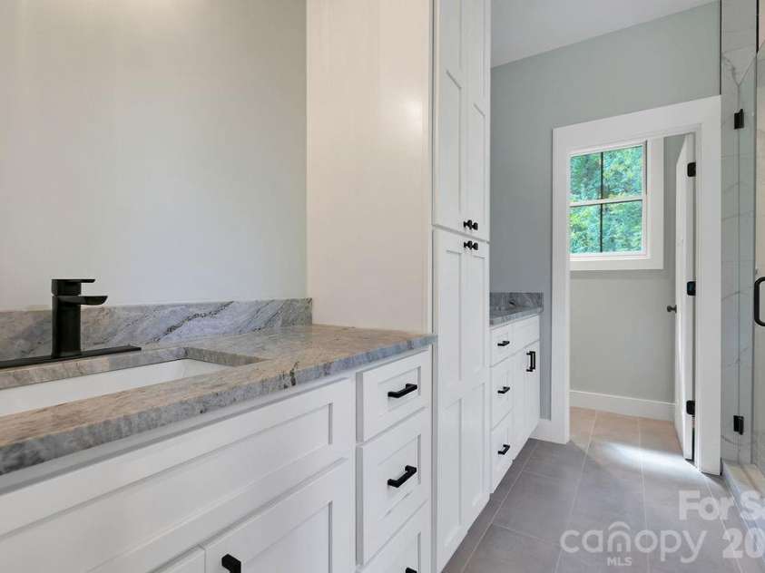 404 High Ridge Drive, Mills River, NC 28759.  MLS# CAR4371927, YatesRealty ID 19089. Dual Custom Vanity in Primary