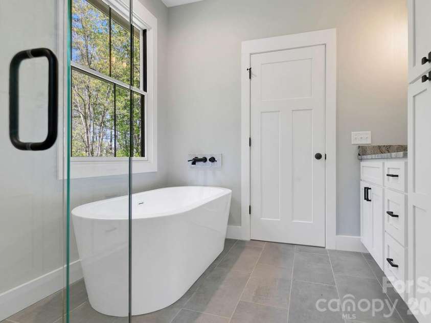 404 High Ridge Drive, Mills River, NC 28759.  MLS# CAR4371927, YatesRealty ID 19089. Free Standing Tub and tiled floor