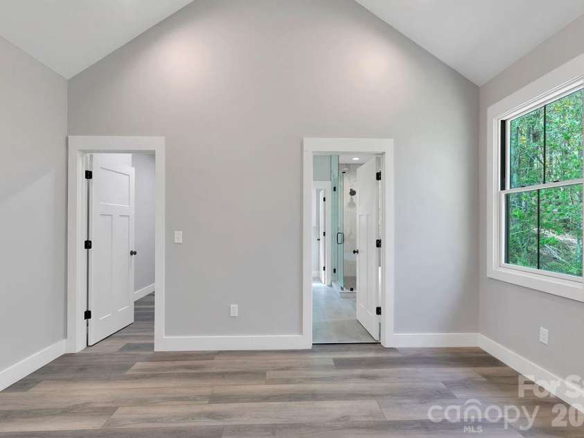 404 High Ridge Drive, Mills River, NC 28759.  MLS# CAR4371927, YatesRealty ID 19089. Primary Bedroom into Bath