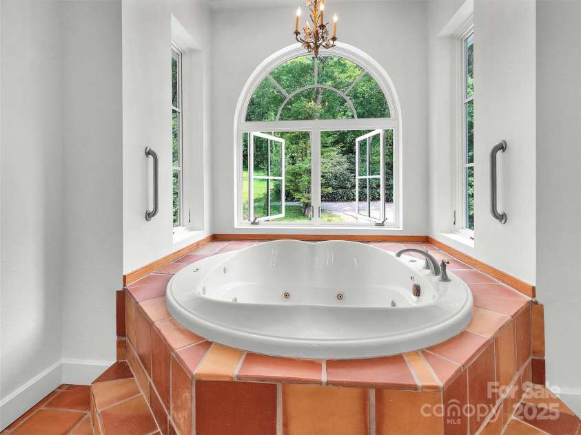2222 Greenspire Drive, Sylva, NC 28779.  MLS# CAR4159278, YatesRealty ID 1909. Jetted tub ready to soak in fresh mountain air.