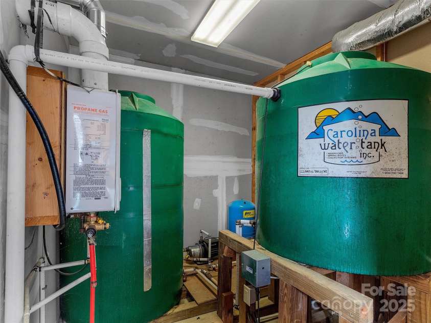2222 Greenspire Drive, Sylva, NC 28779.  MLS# CAR4159278, YatesRealty ID 1909. Well planned utility room complete with water holding tanks, filtration, and more.