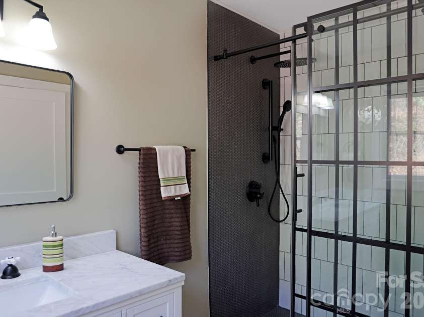 417 Soquili Drive, Brevard, NC 28712.  MLS# CAR4366623, YatesRealty ID 19092. Primary Bath Shower