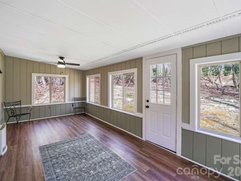 417 Soquili Drive, Brevard, NC 28712.  MLS# CAR4366623, YatesRealty ID 19092. Sunroom with backyard access
