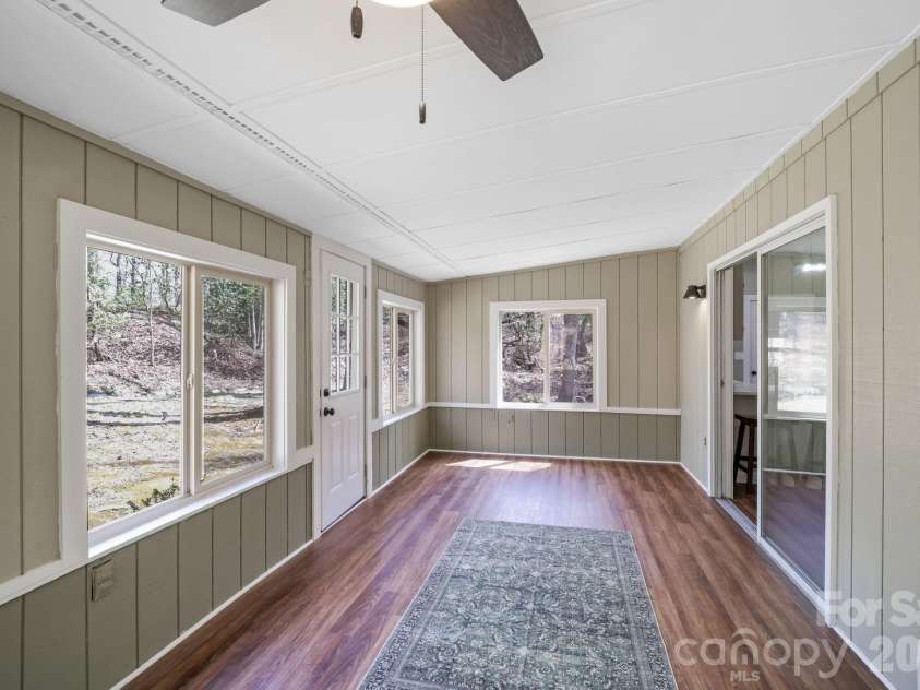 417 Soquili Drive, Brevard, NC 28712.  MLS# CAR4366623, YatesRealty ID 19092. Three Seasons Room - directly access from dining area