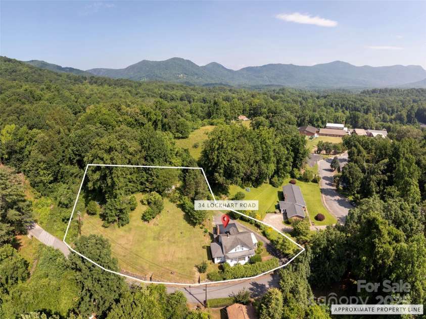 34 Lockhart Road, Tryon, NC 28782.  MLS# CAR4270082, YatesRealty ID 19094. Prime development opportunity with road frontage, multifamily zoning, and city utility access (buyer to verify).