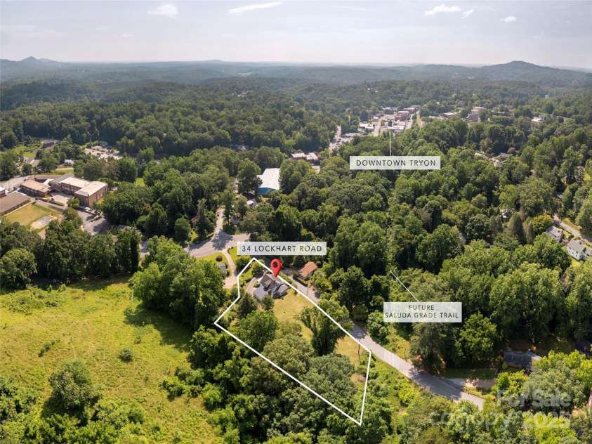 34 Lockhart Road, Tryon, NC 28782.  MLS# CAR4270082, YatesRealty ID 19094. Walkable to downtown Tryon and bordering the proposed Saluda Grade Trail.