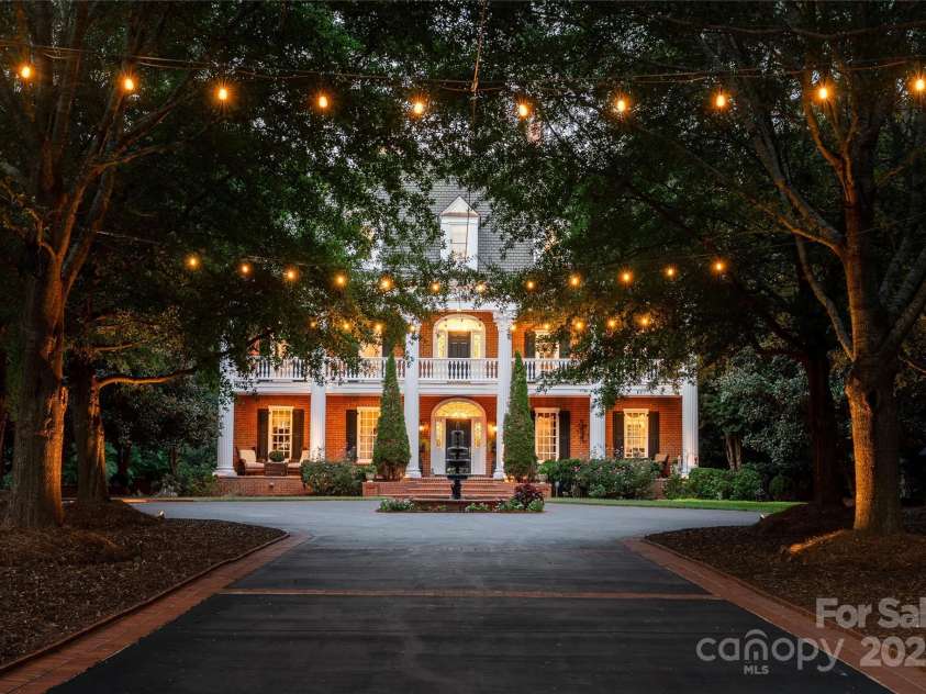 2665 Rolling Hills Drive, Monroe, NC 28110.  MLS# CAR4296531, YatesRealty ID 191. Beautiful tree lined, landscaped and illuminated entrance.