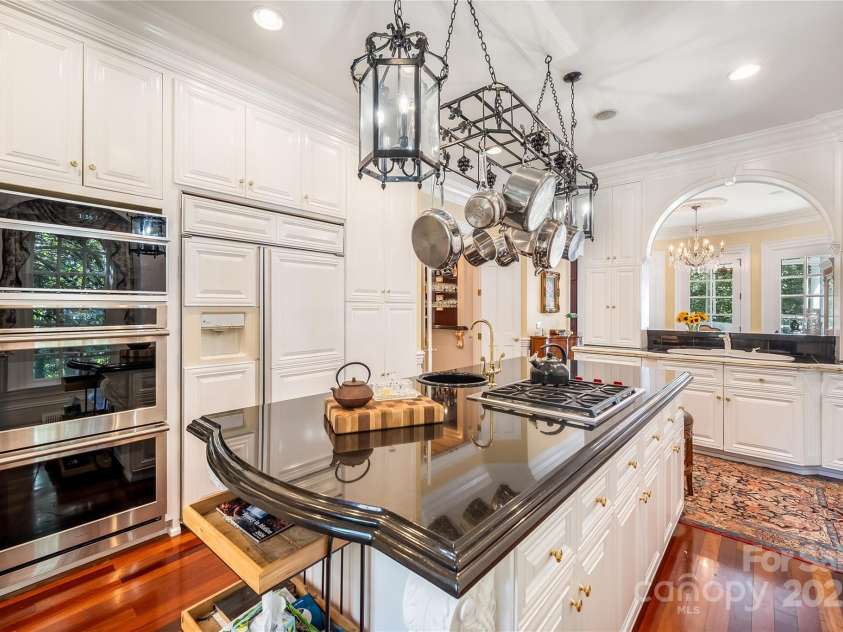 2665 Rolling Hills Drive, Monroe, NC 28110.  MLS# CAR4296531, YatesRealty ID 191. High end appliances, a central island and tons of pantry and counter space.  Informal dining and wet bar are just a step away.