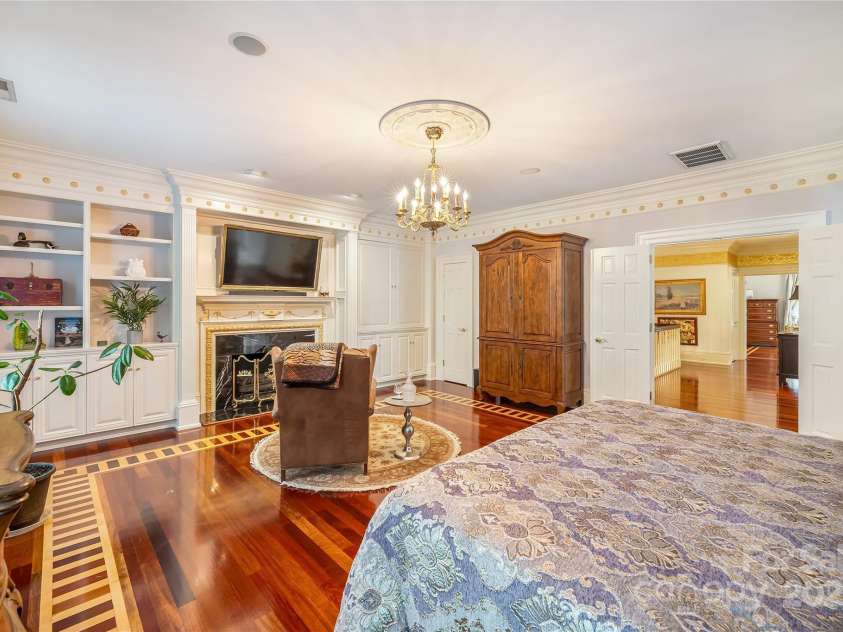 2665 Rolling Hills Drive, Monroe, NC 28110.  MLS# CAR4296531, YatesRealty ID 191. In laid hardwood flooring, custom mill work and fireplace details continue into the suites.