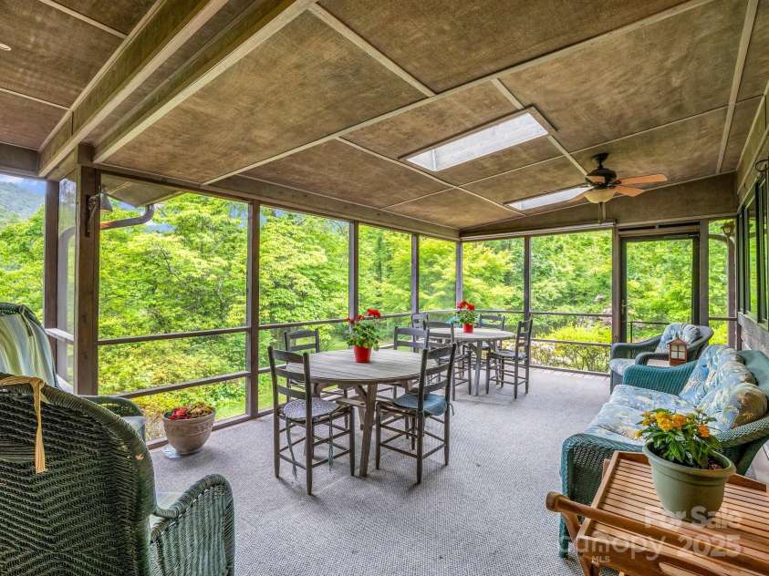 133 Pennwood Lane, Flat Rock, NC 28731.  MLS# CAR4268654, YatesRealty ID 19101. Covered, screened side porch.