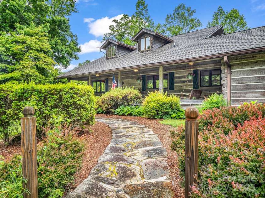 133 Pennwood Lane, Flat Rock, NC 28731.  MLS# CAR4268654, YatesRealty ID 19101. Escape to the front porch.