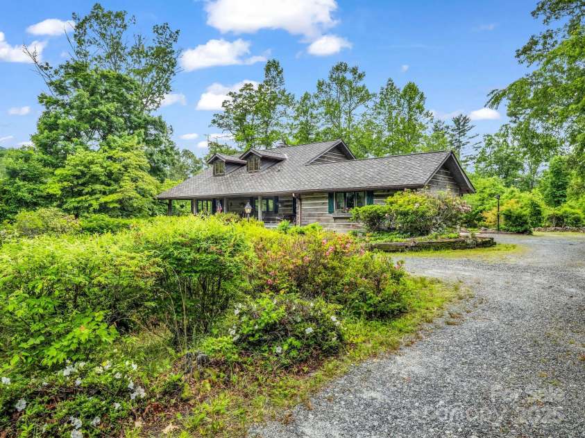 133 Pennwood Lane, Flat Rock, NC 28731.  MLS# CAR4268654, YatesRealty ID 19101. Lush, native landscaping.