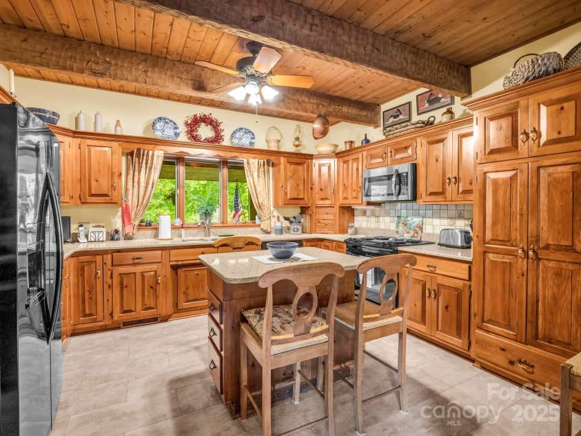 133 Pennwood Lane, Flat Rock, NC 28731.  MLS# CAR4268654, YatesRealty ID 19101. New kitchen tile floor.