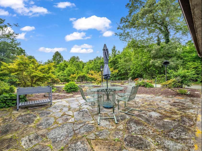 133 Pennwood Lane, Flat Rock, NC 28731.  MLS# CAR4268654, YatesRealty ID 19101. Side Patio off Kitchen