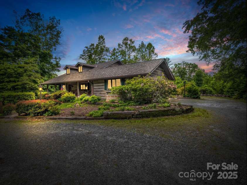 133 Pennwood Lane, Flat Rock, NC 28731.  MLS# CAR4268654, YatesRealty ID 19101. Virtual Twilight. Home situated for privacy on 5.31 acres.