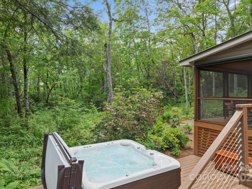 891 Crescent Trail, Highlands, NC 28741.  MLS# CAR4270133, YatesRealty ID 19103. Hot Tub on Main House Back Deck Overlooking USFS