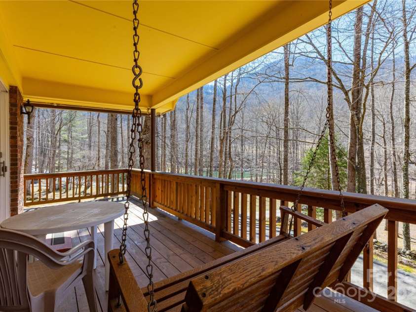 3601 Conleys Creek Road, Whittier, NC 28789.  MLS# CAR4231007, YatesRealty ID 1911. Wraparound Porch