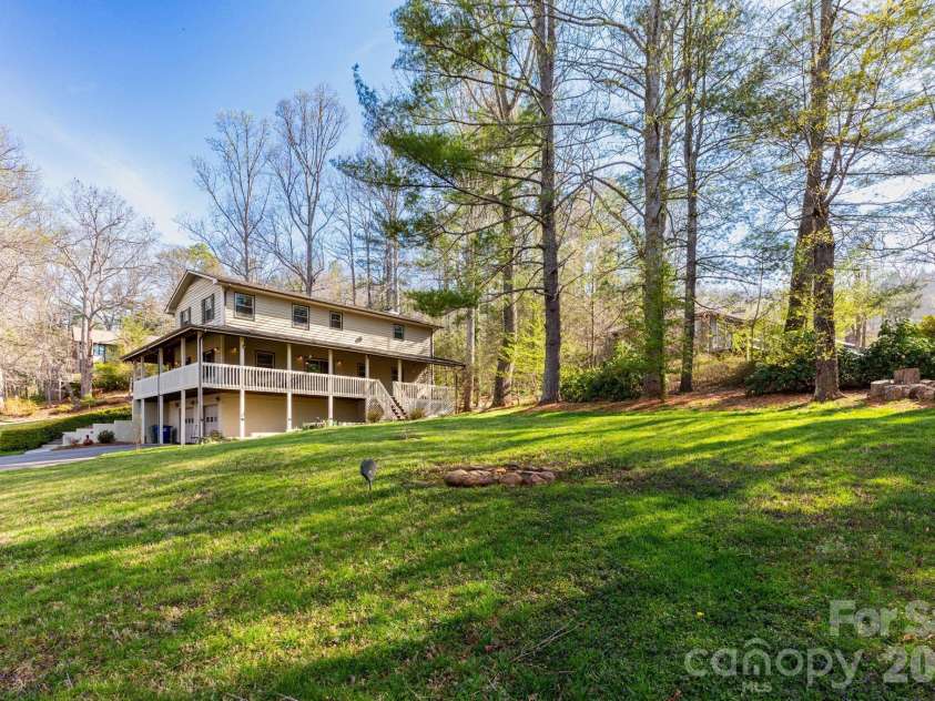 121 Churchill Downs Drive, Fairview, NC 28730.  MLS# CAR4366087, YatesRealty ID 19111. Backyard w/ Firepit