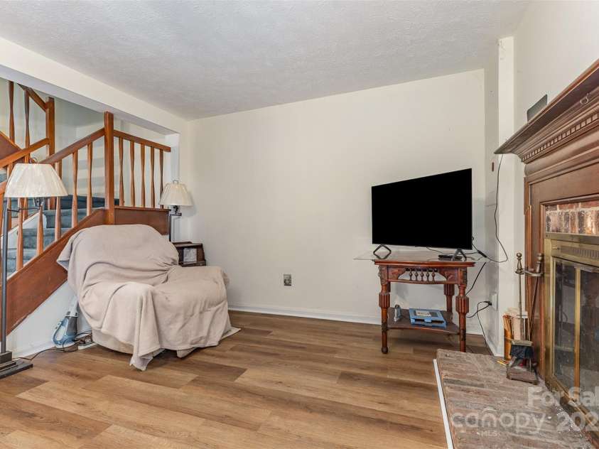7304 Pebblestone Drive, Charlotte, NC 28212.  MLS# CAR4263270, YatesRealty ID 19112. Living Room with fireplace