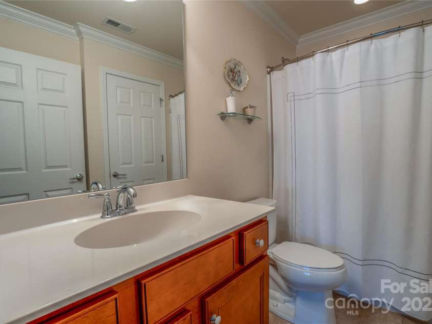 5981 Bison Court, Fort Mill, SC 29707.  MLS# CAR4209412, YatesRealty ID 19113. Full guest bath main floor