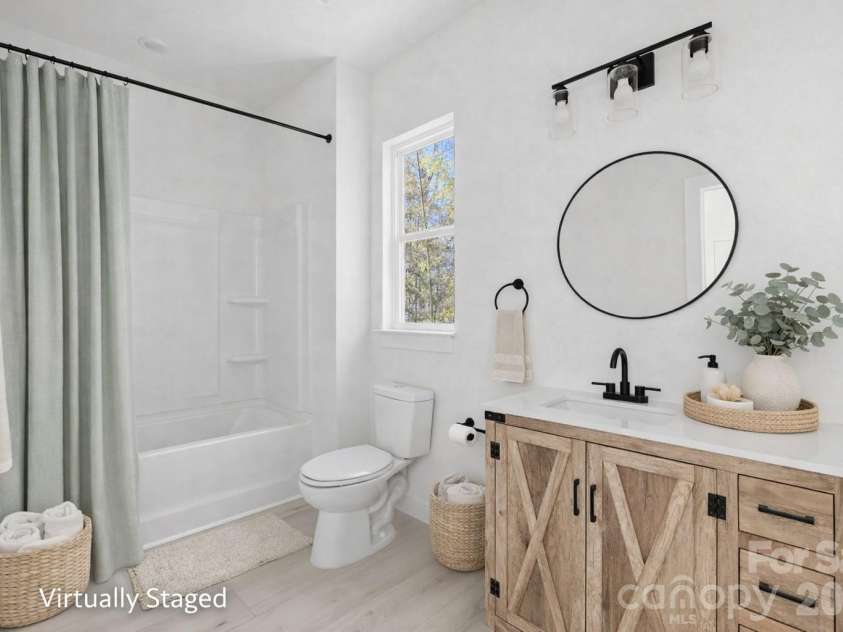 659 Stillgreen Lane, Charlotte, NC 28214.  MLS# CAR4356010, YatesRealty ID 19119. Guest Bathroom - Virtually Staged Photo