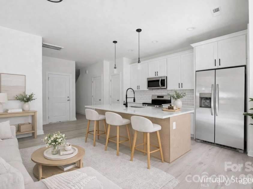 659 Stillgreen Lane, Charlotte, NC 28214.  MLS# CAR4356010, YatesRealty ID 19119. Kitchen with island and the refrigerator is included!  Virtually Staged Photo