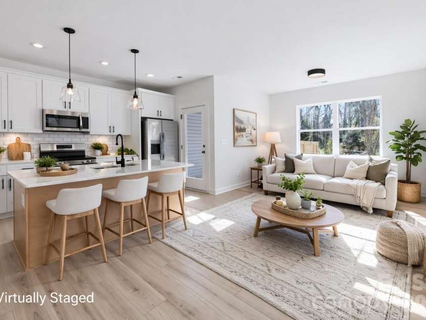 659 Stillgreen Lane, Charlotte, NC 28214.  MLS# CAR4356010, YatesRealty ID 19119. Open main living area with lots of sunlight! Virtually Staged Photo