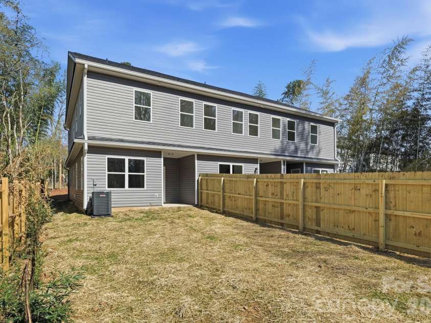 659 Stillgreen Lane, Charlotte, NC 28214.  MLS# CAR4356010, YatesRealty ID 19119. Partial view of the extra large lot! Keep scrolling to see the plat showing the expansive lot this unit has to offer!