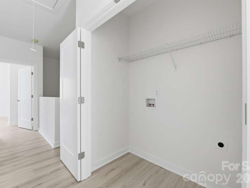 659 Stillgreen Lane, Charlotte, NC 28214.  MLS# CAR4356010, YatesRealty ID 19119. Second Floor Laundry