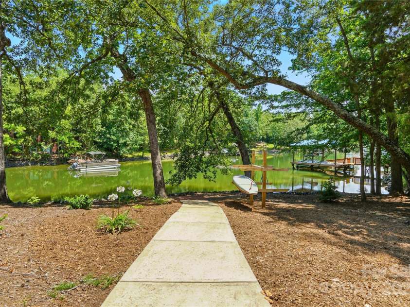 16525 Tulloch Road, Charlotte, NC 28278.  MLS# CAR4267483, YatesRealty ID 19120. A short, gentle walk leads you to the water's edge, where you'll find approximately 110 feet of private shoreline  – ideal for all your lakeside adventures.