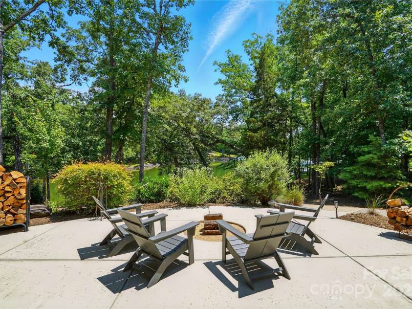 16525 Tulloch Road, Charlotte, NC 28278.  MLS# CAR4267483, YatesRealty ID 19120. Cozy around the firepit on cool evenings