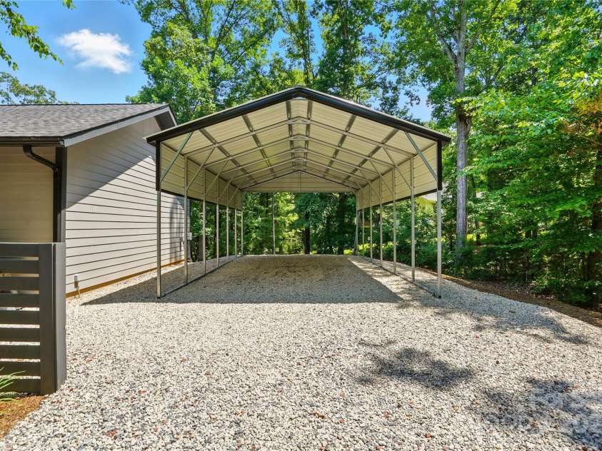 16525 Tulloch Road, Charlotte, NC 28278.  MLS# CAR4267483, YatesRealty ID 19120. RV carport with power and sewer dump, and plenty of room for all your lake-life toys.