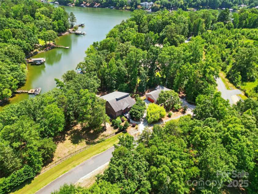 16525 Tulloch Road, Charlotte, NC 28278.  MLS# CAR4267483, YatesRealty ID 19120. This is more than a home; it's a statement of unparalleled design and a gateway to an extraordinary Lake Wylie lifestyle