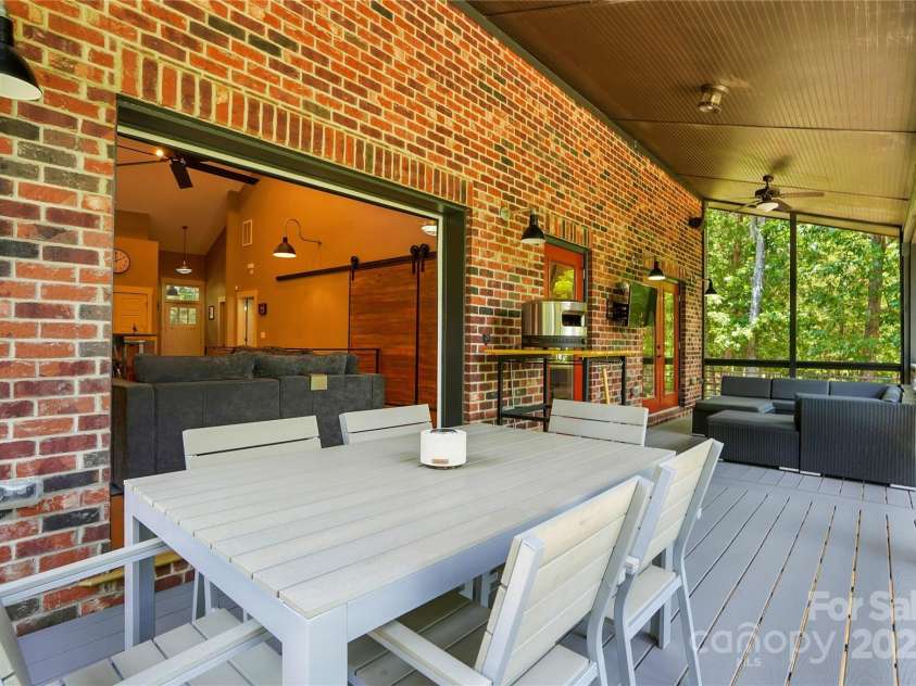 16525 Tulloch Road, Charlotte, NC 28278.  MLS# CAR4267483, YatesRealty ID 19120. You’ll spend hours lingering over morning coffee, reading a book, or relaxing & enjoying the impressive lake views from the fabulous screened porch
