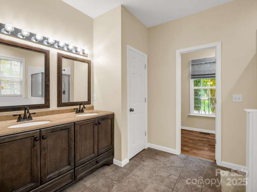 24 Yorktown Circle, Arden, NC 28704.  MLS# CAR4262895, YatesRealty ID 19123. First floor primary bathroom