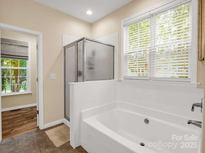24 Yorktown Circle, Arden, NC 28704.  MLS# CAR4262895, YatesRealty ID 19123. First floor primary bathroom