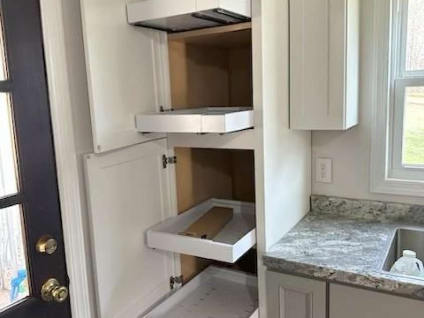 188 Wiggins Road, Candler, NC 28715.  MLS# CAR4377561, YatesRealty ID 19126. Pull out shelving